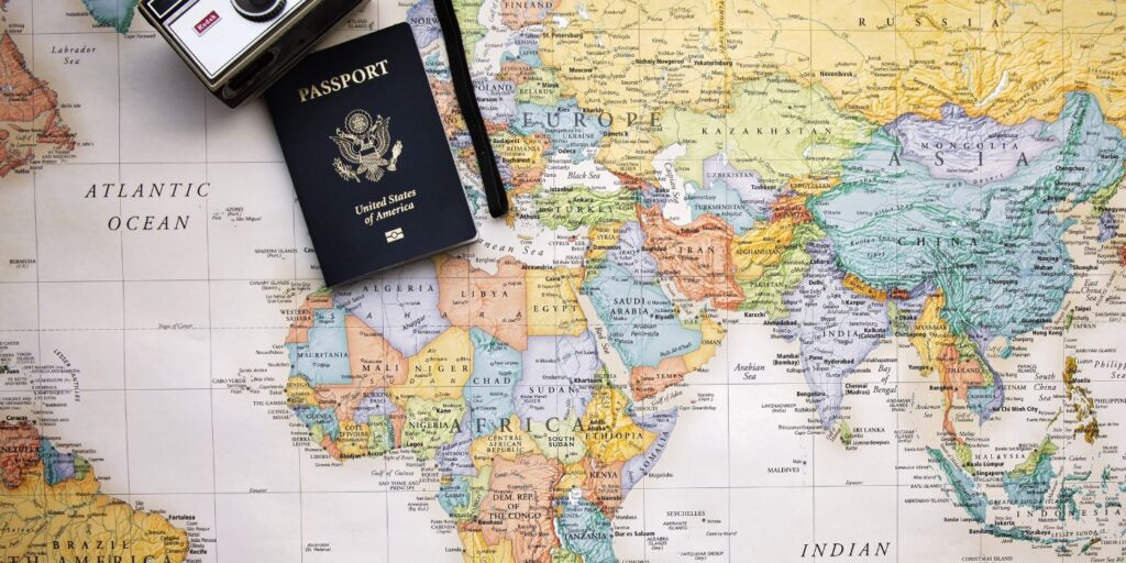 Travel image of map with passport and camera